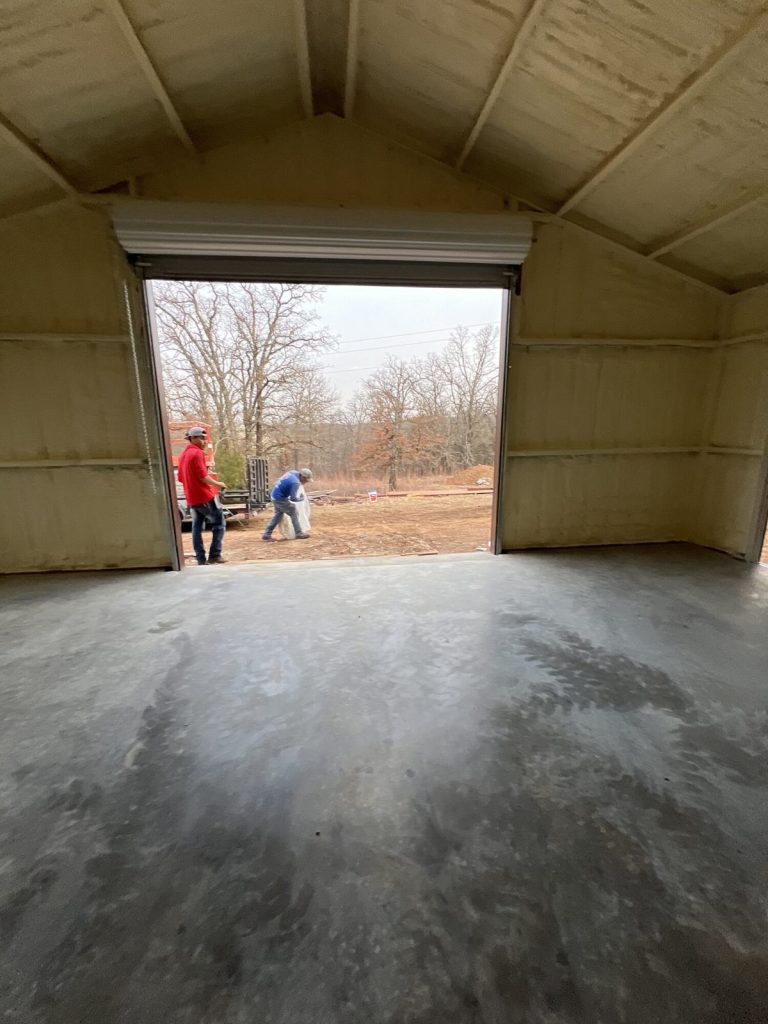 Metal barn insulated with spray foam