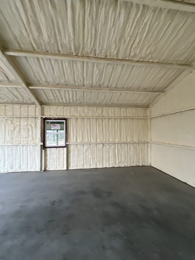 Spray foam insulated metal walls around a window