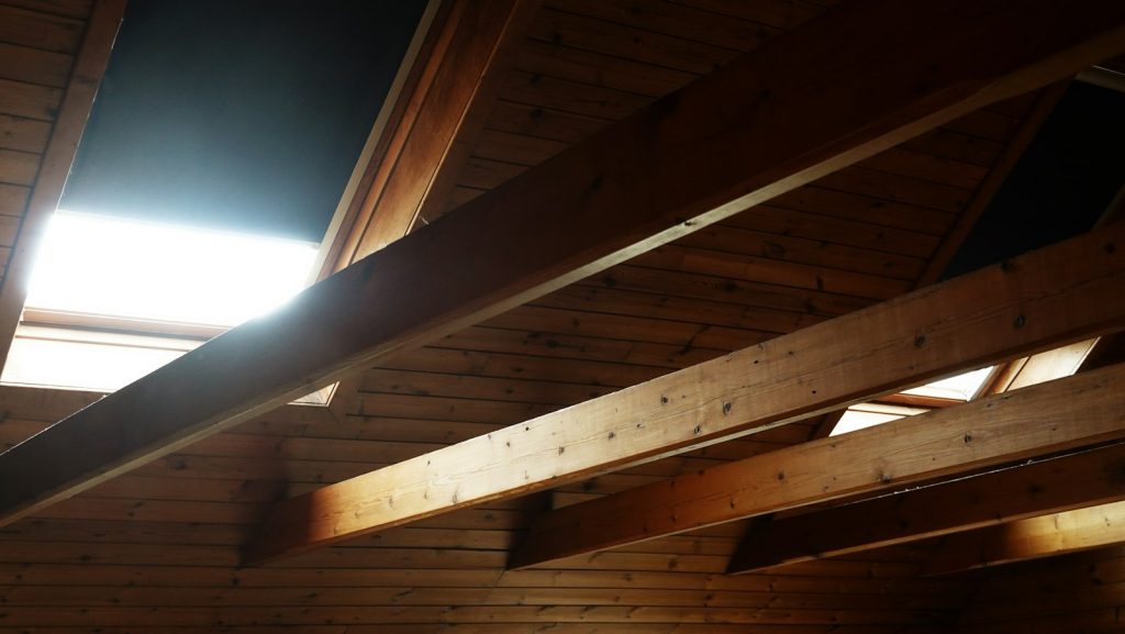 Attic rafters and roof deck before insulation